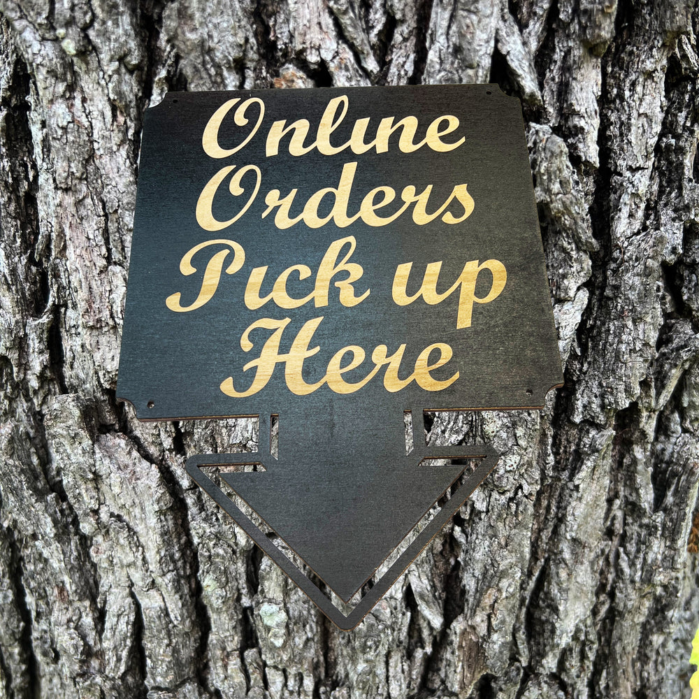 HipFlaskPlus Online Orders Pick Up Here black wood arrow sign on a tree trunk
