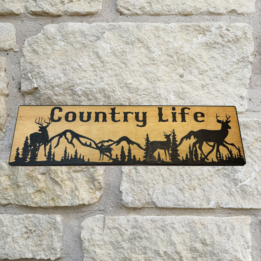 HipFlaskPlus Country Life deer mountain scene black and natural wood sign on a stone wall