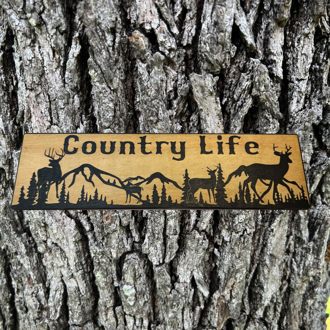 HipFlaskPlus Country Life deer mountain scene black and natural wood sign on a tree trunk
