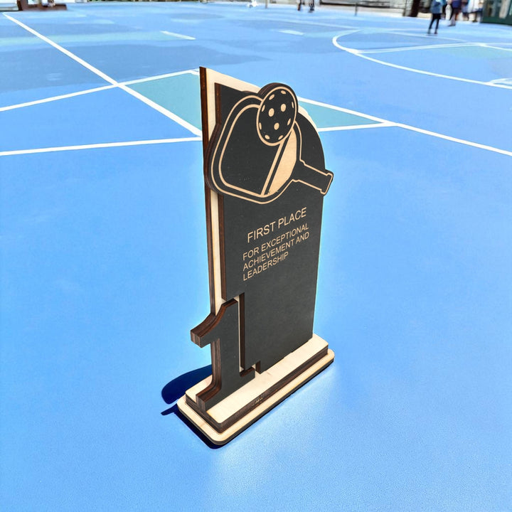 HipFlaskPlus custom Pickleball first place trophy award side view on a pickleball court
