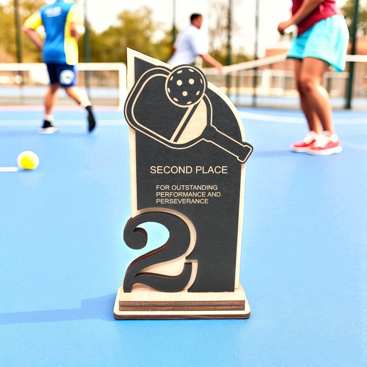 HipFlaskPlus custom Pickleball second place trophy award on a pickleball court