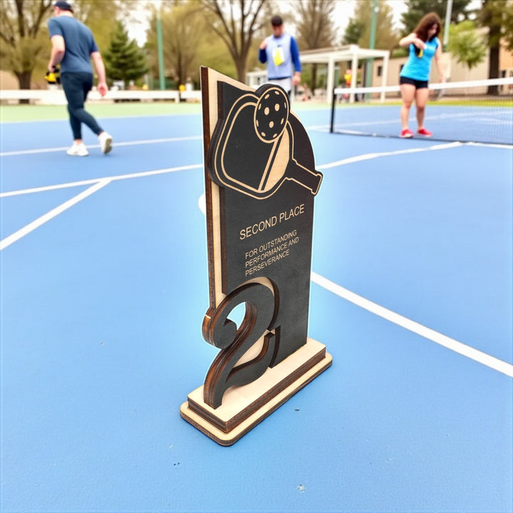 HipFlaskPlus custom Pickleball second place trophy award side view on a pickleball court