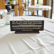 Sign - English & Spanish - With STAND - We are not a fast food restaurant Please Be Patient - 10x4 Inches
