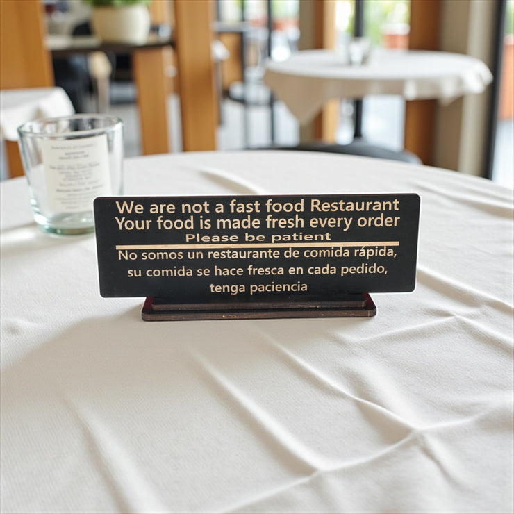Sign - English & Spanish - With STAND - We are not a fast food restaurant Please Be Patient - 10x4 Inches
