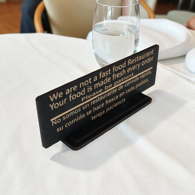 Sign - English & Spanish - With STAND - We are not a fast food restaurant Please Be Patient - 10x4 Inches