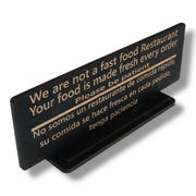 Sign - English & Spanish - With STAND - We are not a fast food restaurant Please Be Patient - 10x4 Inches