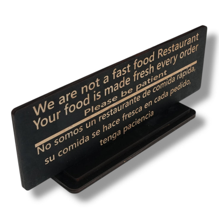 Sign - English & Spanish - With STAND - We are not a fast food restaurant Please Be Patient - 10x4 Inches