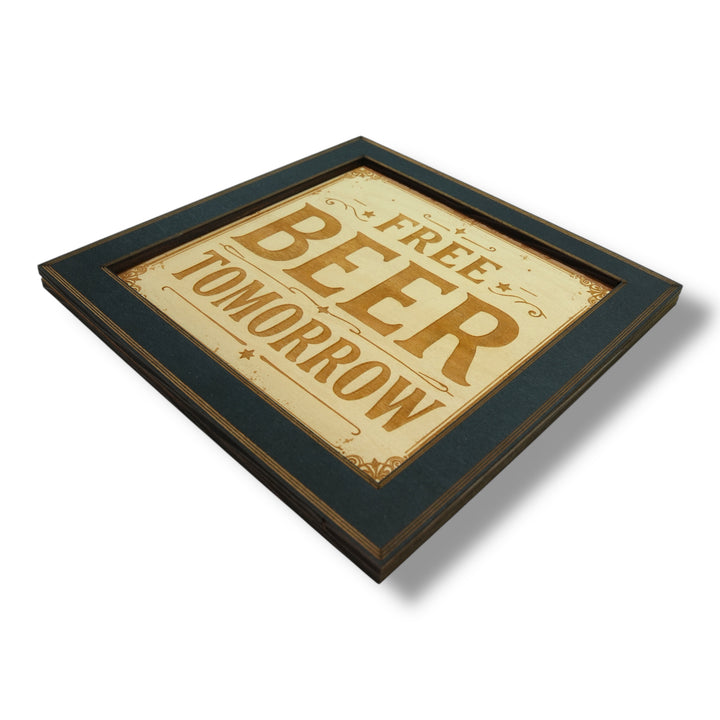 HipFlaskPlus Free Beer Tomorrow bar sign engraved wood wall art in a black frame in an angled close-up
