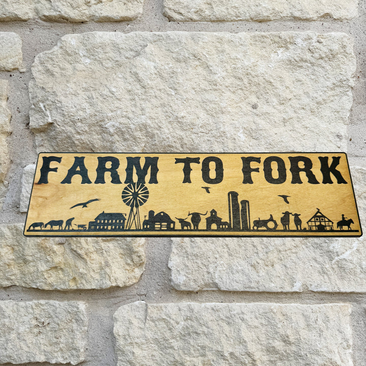 HipFlaskPlus Farm to Fork black and natural wood sign on a stone wall