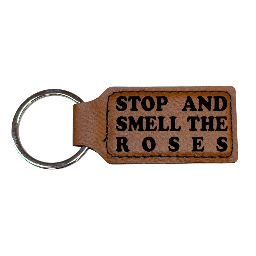 HipFlaskPlus brown leather rectangle keychain with Stop and Smell the Roses engraving