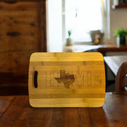 Texas Home with Bluebonnets - Cutting Board 14''x9.5''x.5'' Bamboo