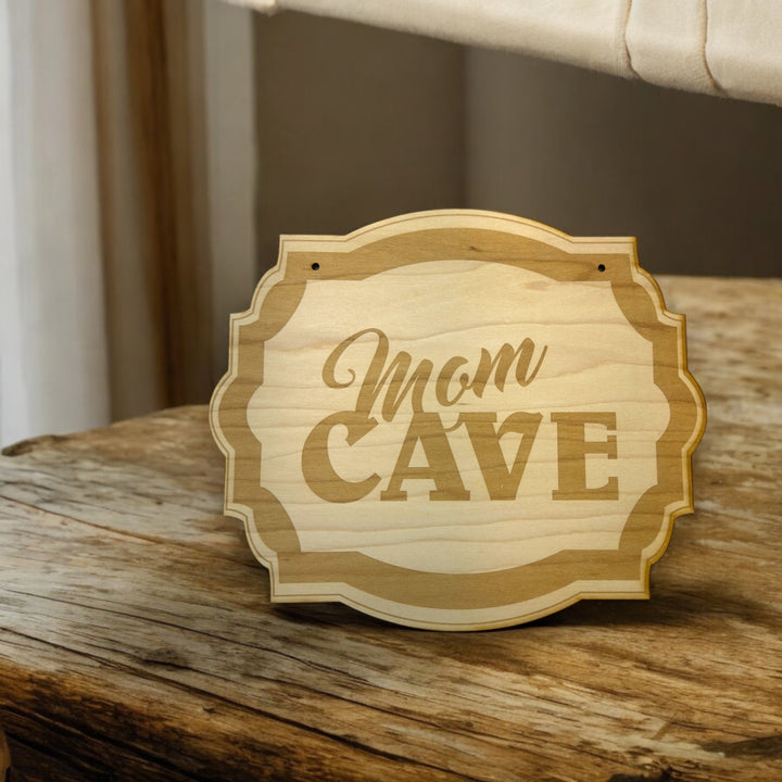 HipFlaskPlus Mom Cave raw wood door sign on a wooden table