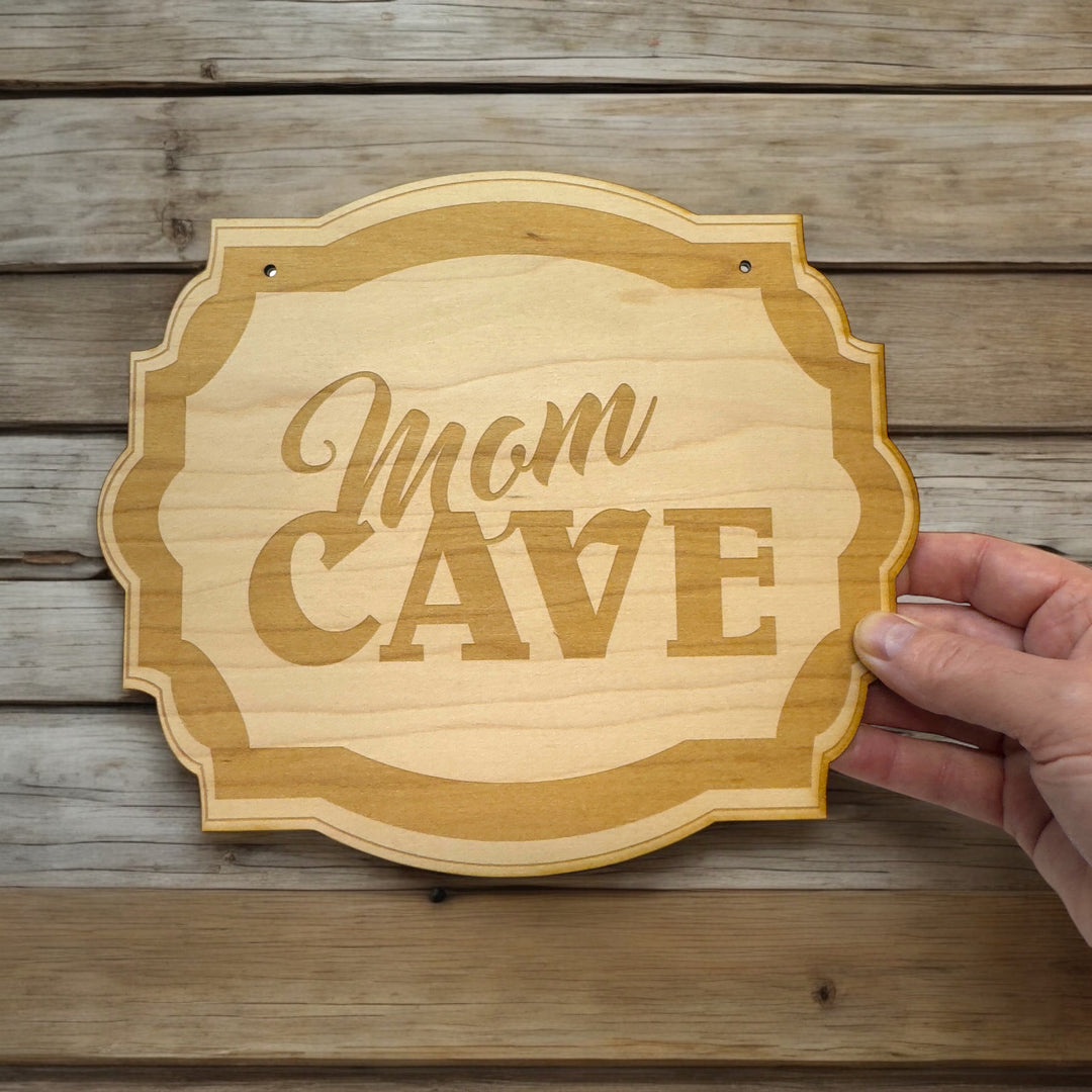 HipFlaskPlus Mom Cave raw wood door sign on rustic wood