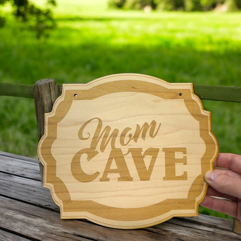 HipFlaskPlus Mom Cave raw wood door sign on grass