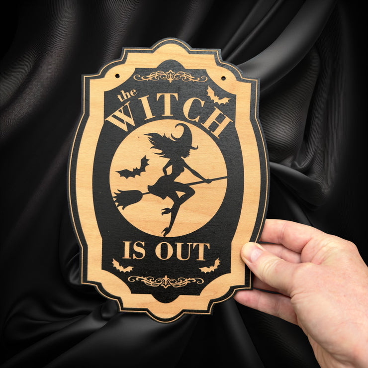 The Witch is Out - Black Halloween Door Sign 6x9