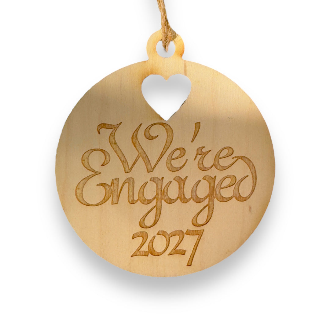 HipFlaskPlus raw wood We're Engaged 2027 heart ornament