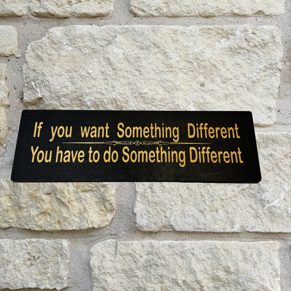 HipFlaskPlus If You Want Something Different You Have to Do Something Different black wood sign on a stone wall