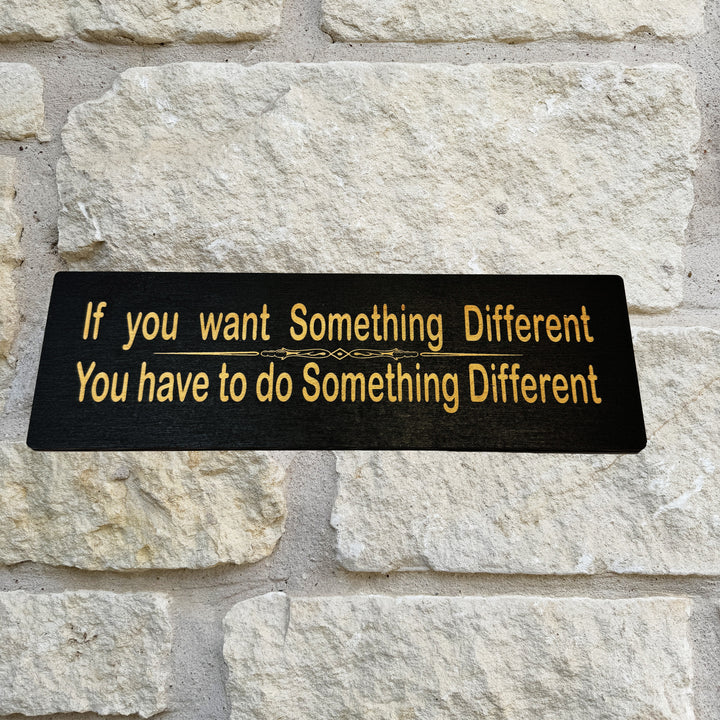 HipFlaskPlus If You Want Something Different You Have to Do Something Different black wood sign on a stone wall