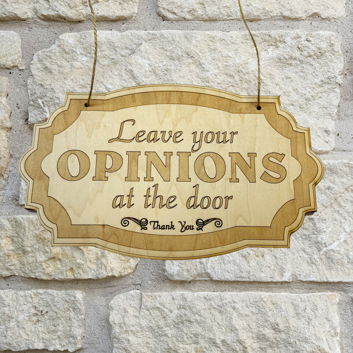 HipFlaskPlus Leave Your Opinions at the Door raw wood door sign on a stone wall