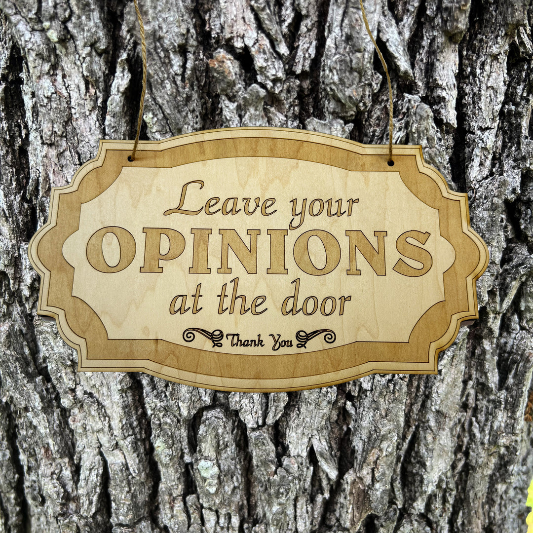 HipFlaskPlus Leave Your Opinions at the Door raw wood door sign on a tree trunk