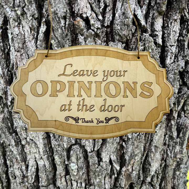 HipFlaskPlus Leave Your Opinions at the Door raw wood door sign on a tree trunk