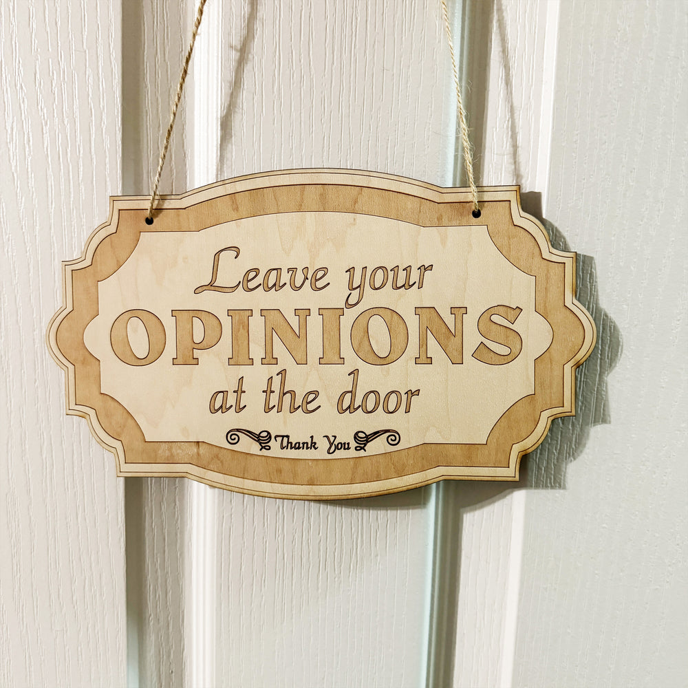 HipFlaskPlus Leave Your Opinions at the Door raw wood door sign on a door