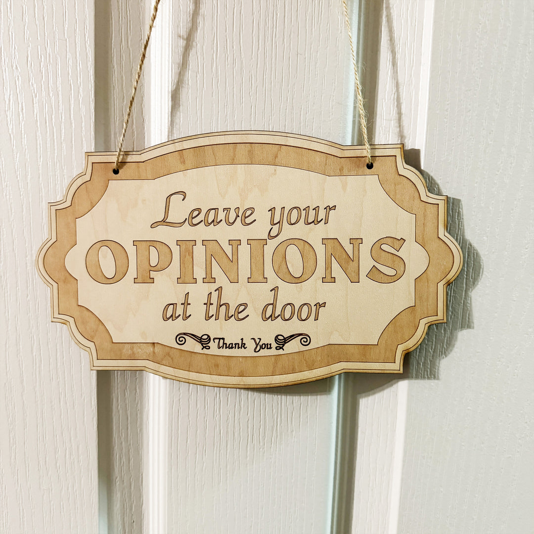 HipFlaskPlus Leave Your Opinions at the Door raw wood door sign on a door