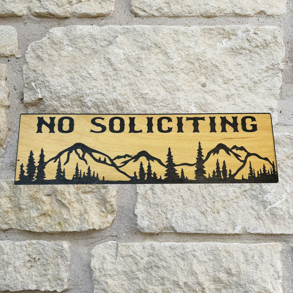 HipFlaskPlus No Soliciting mountain scene black and natural wood sign on a stone wall