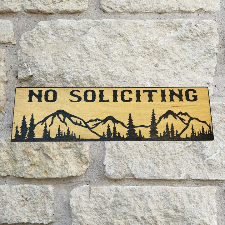 HipFlaskPlus No Soliciting mountain scene black and natural wood sign on a stone wall