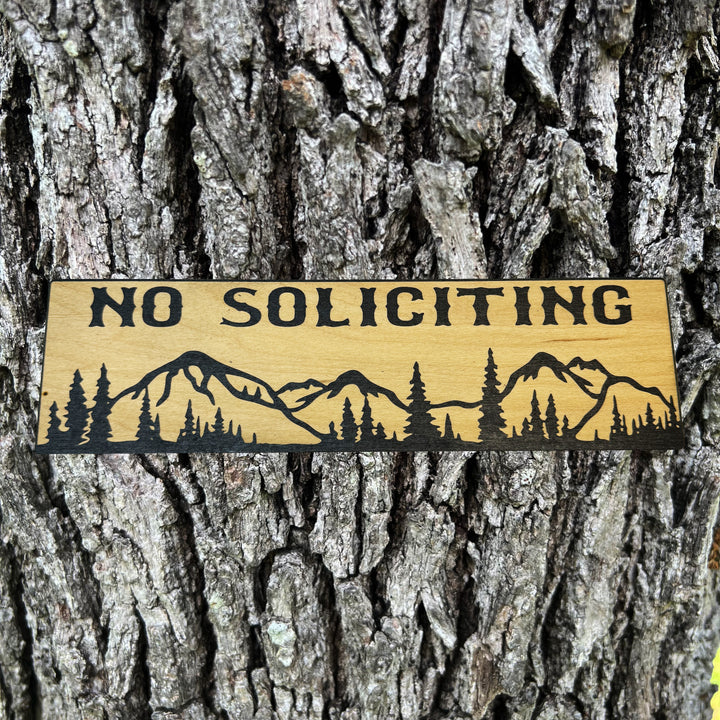 HipFlaskPlus No Soliciting mountain scene black and natural wood sign on a tree trunk