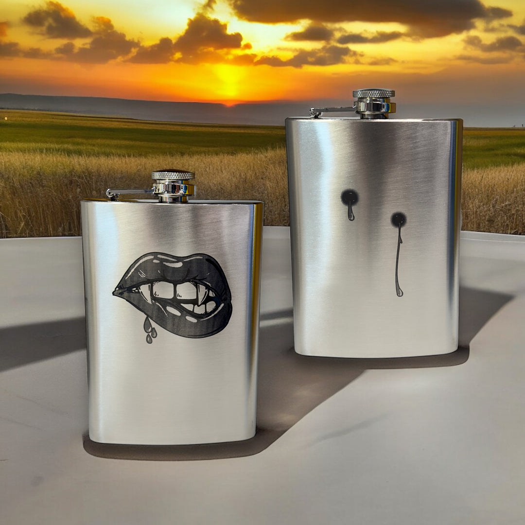 HipFlaskPlus 8oz stainless steel hip flasks engraved with his and hers vampire lips and fangs set of two at sunset
