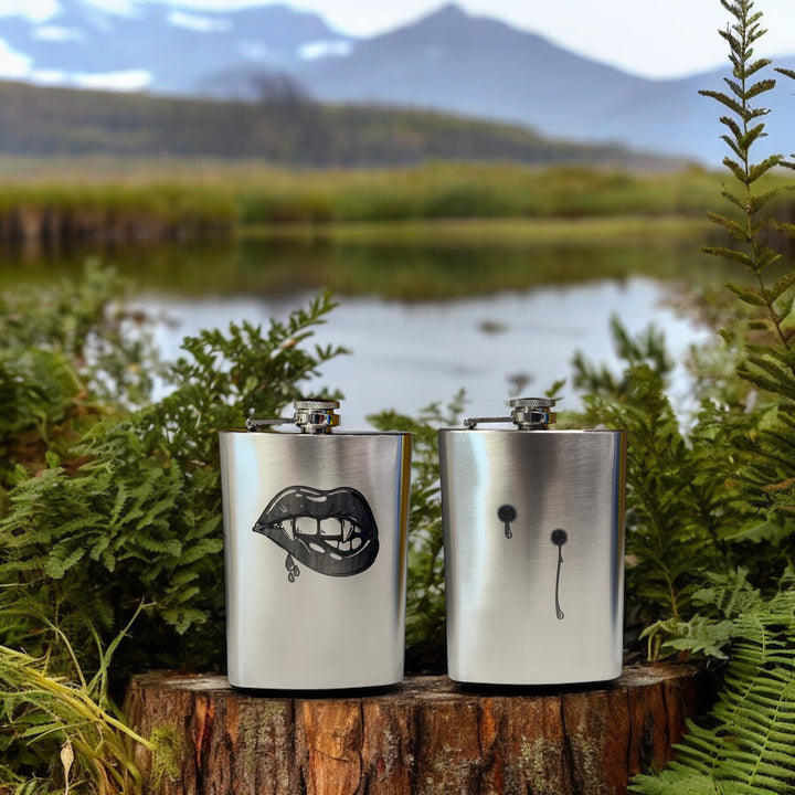 HipFlaskPlus 8oz stainless steel hip flasks engraved with his and hers vampire lips and fangs set of two by a lake