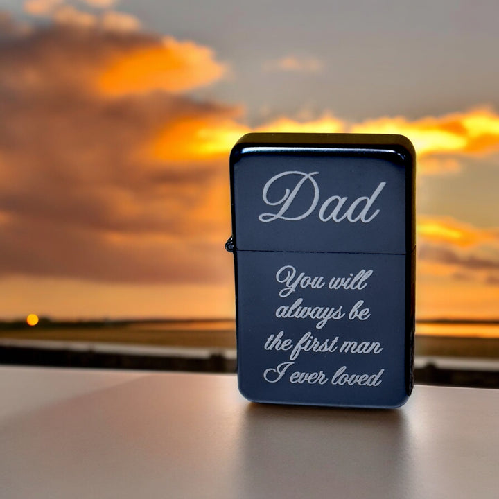 HipFlaskPlus black Dad first man I ever loved lighter on a table at sunset
