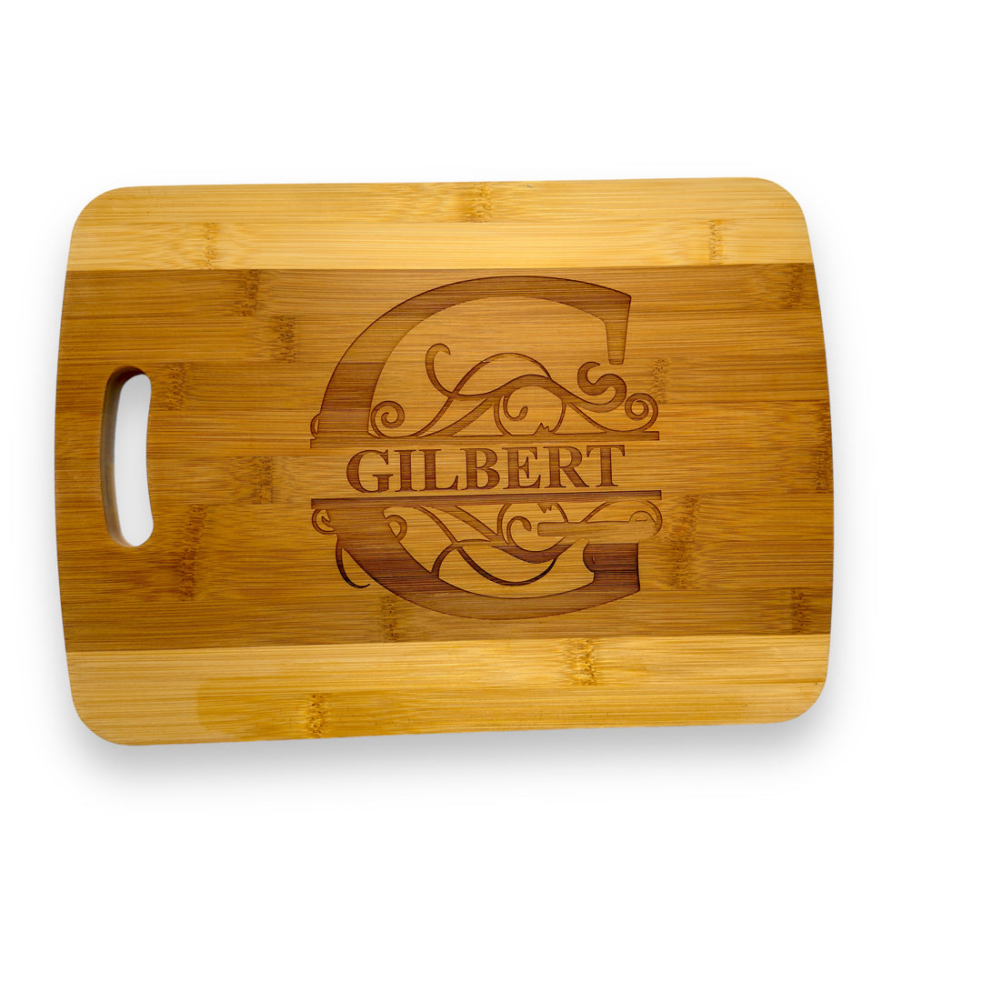 HipFlaskPlus bamboo cutting board engraved with a personalized split letter monogram and name