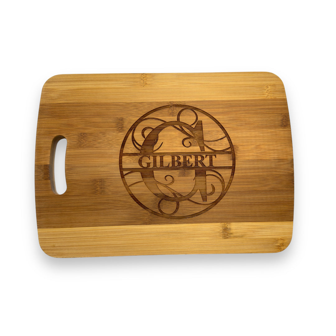 HipFlaskPlus bamboo cutting board engraved with a personalized split letter monogram and name