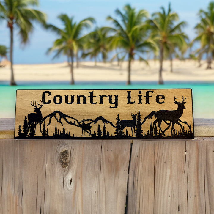 HipFlaskPlus Country Life deer mountain scene black and natural wood sign at a tropical beach