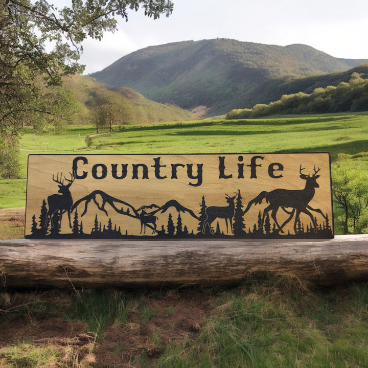 HipFlaskPlus Country Life deer mountain scene black and natural wood sign on a log by mountains