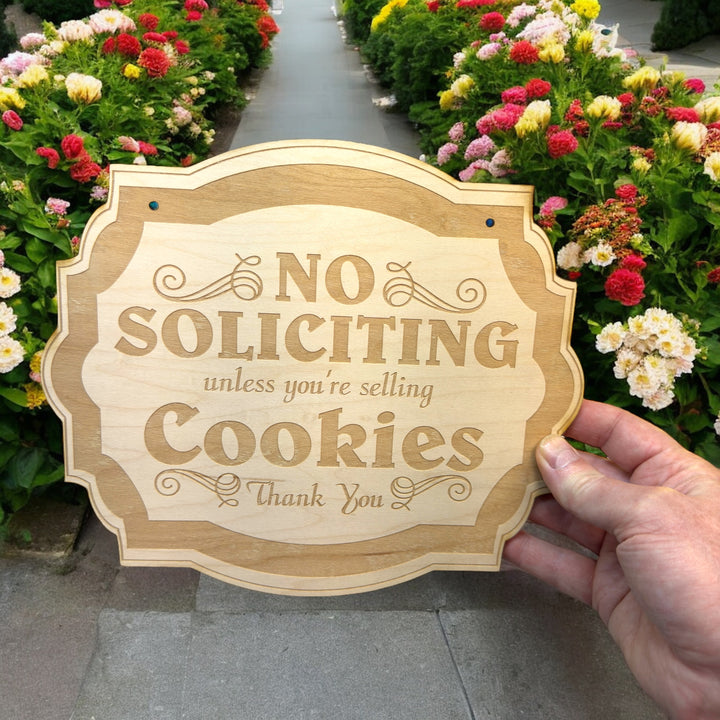 Hand holding a HipFlaskPlus No Soliciting Unless You&