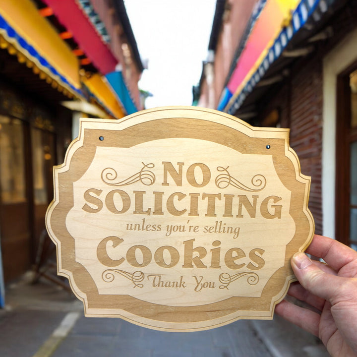 Hand holding a HipFlaskPlus No Soliciting Unless You&