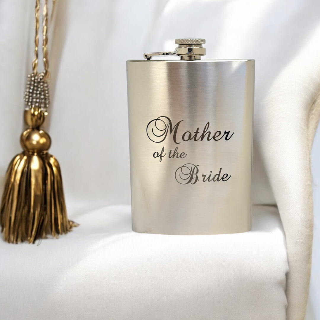 HipFlaskPlus 8oz stainless steel hip flask engraved with Mother of the Bride by a curtain