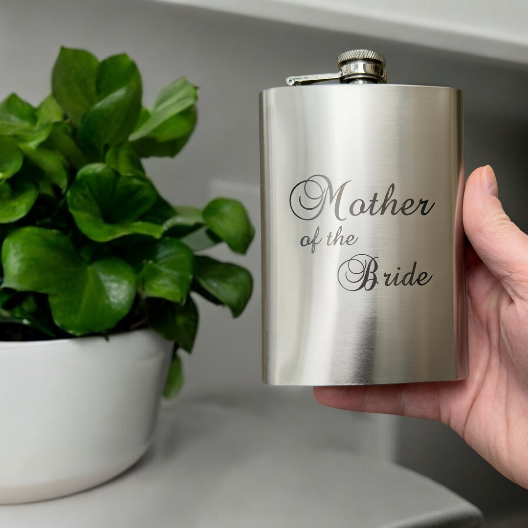 HipFlaskPlus 8oz stainless steel hip flask engraved with Mother of the Bride by a plant
