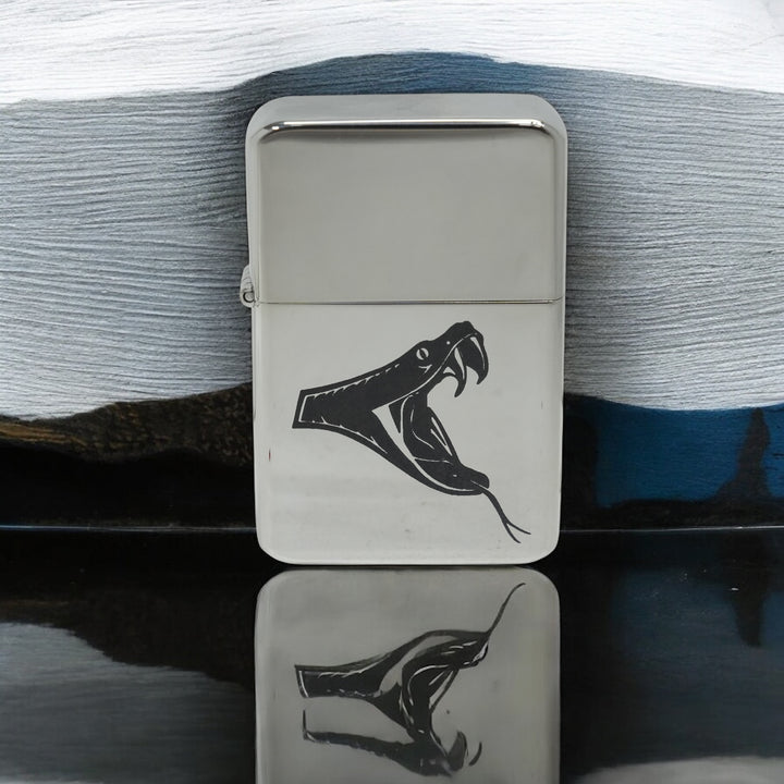 HipFlaskPlus poison viper chrome lighter on a reflective surface