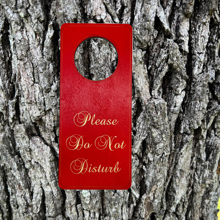 HipFlaskPlus red Please Do Not Disturb wood door hanger on a tree trunk