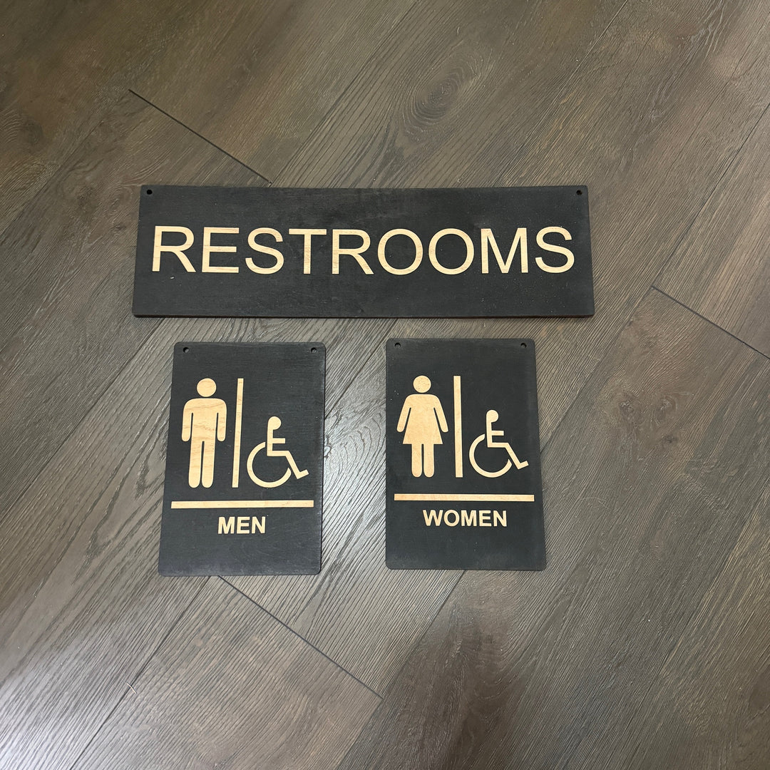 HipFlaskPlus Restrooms Men and Women black wood signs on a wood wall