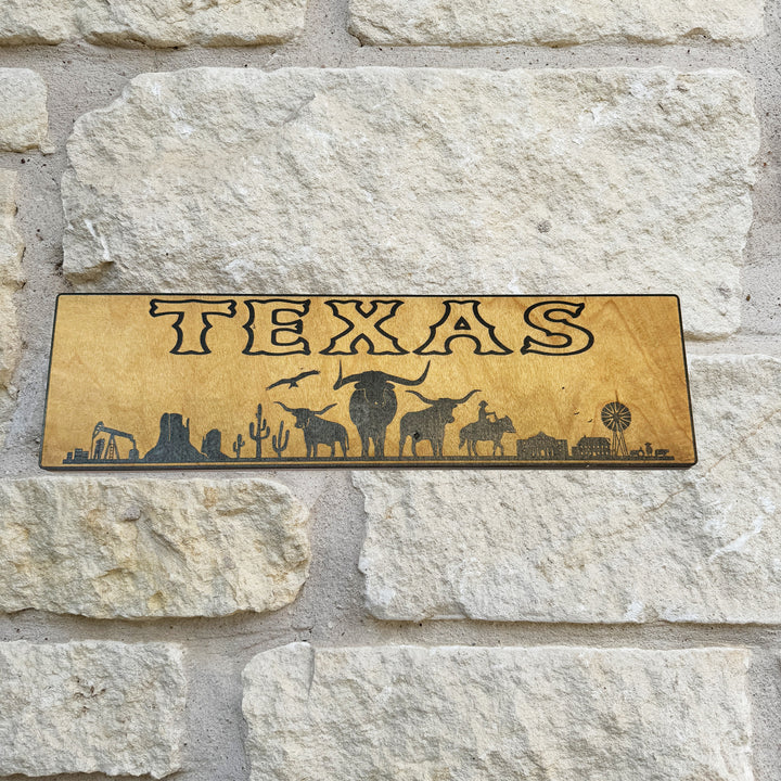 HipFlaskPlus Texas landscape black and natural wood sign on a stone wall