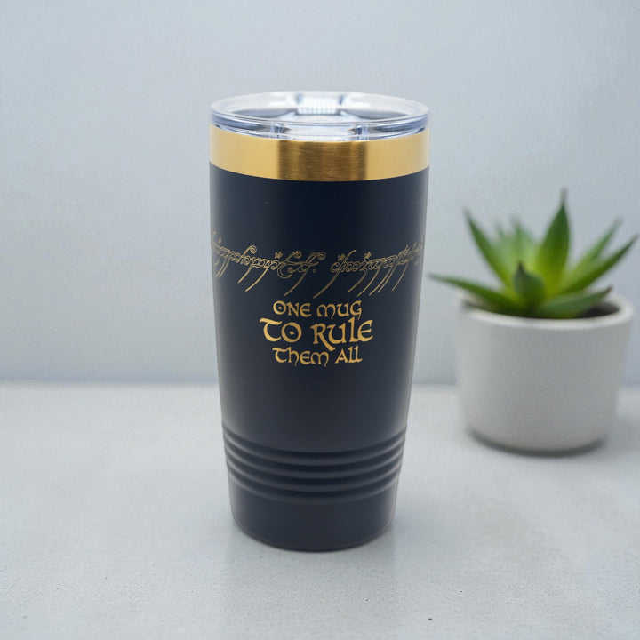 HipFlaskPlus 20oz black stainless steel tumbler with gold top band and laser engraved One Mug To Rule Them All text