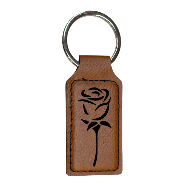 HipFlaskPlus rectangular brown leatherette keychain featuring a laser-engraved black rose design and metal ring.