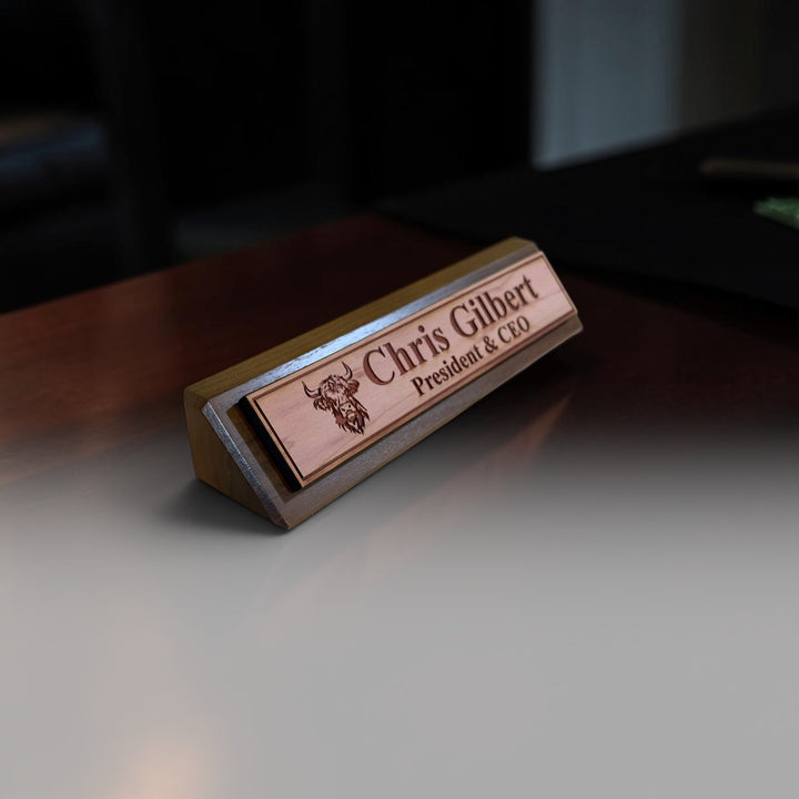 HipFlaskPlus personalized 11-inch cedar desk wedge name plate featuring a laser-engraved highland cow and name