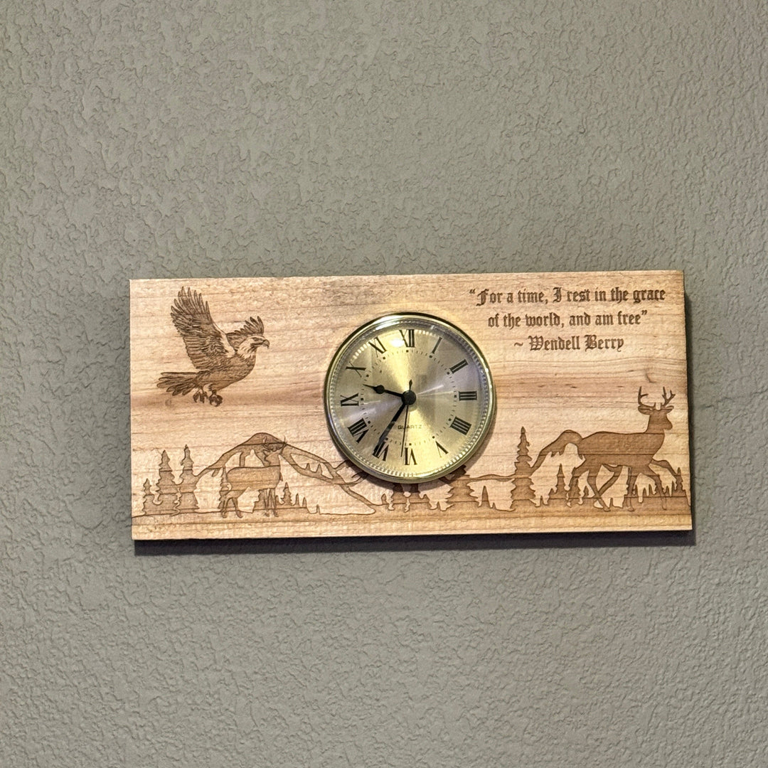 HipFlaskPlus cedar picket wall clock featuring a laser-engraved deer, eagle, and mountain scene with a quote.