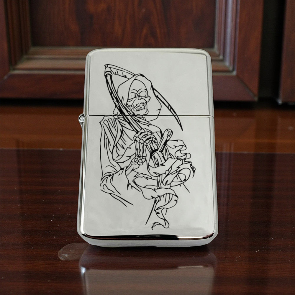 HipFlaskPlus chrome windproof lighter featuring a black engraved grim reaper dealer of death design in a gift tin